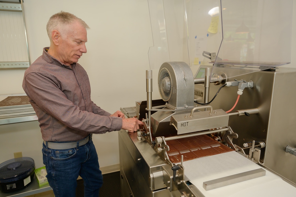 Kevin explains how the robing machine works.