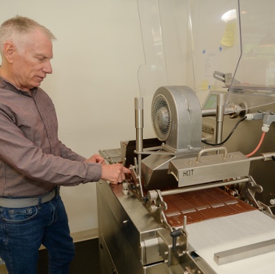Kevin explains how the robing machine works.