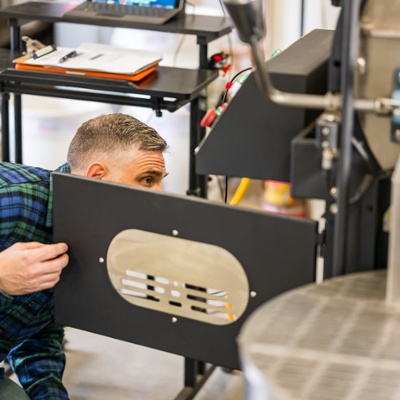 Inspecting the roaster.<br>