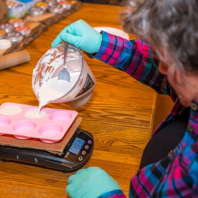 Pouring the secret mix into molds.<br>