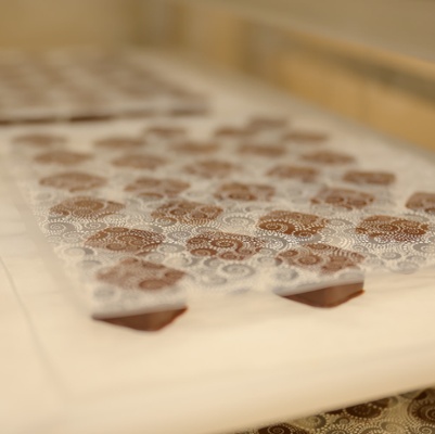 Imprinting designs on truffles.